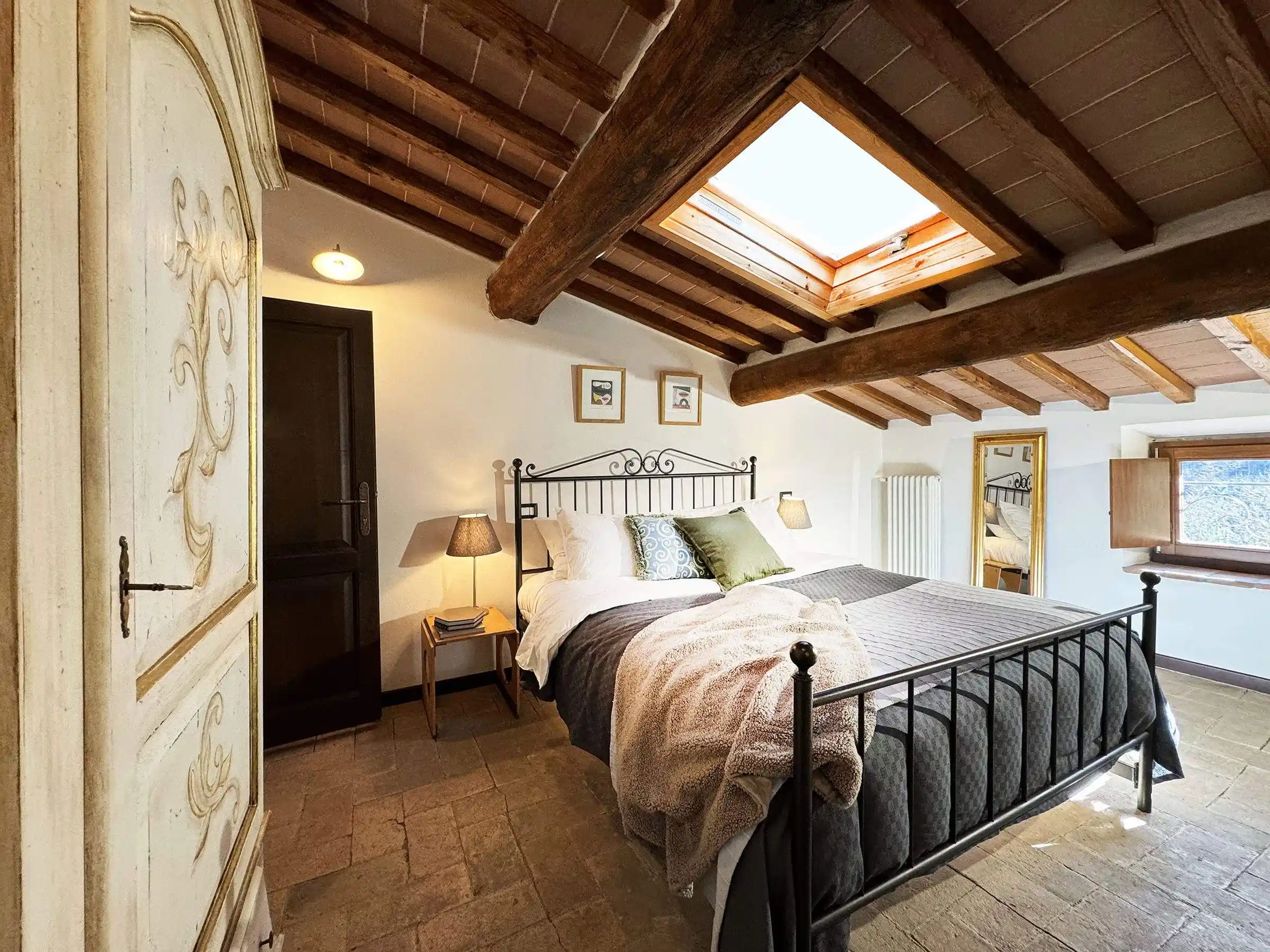 Standard room at Il Vigno agriturismo — stone walls and Tuscan views
